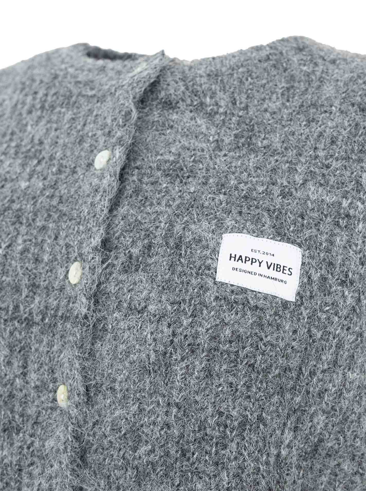 Strickweste mit Knöpfen und Patch